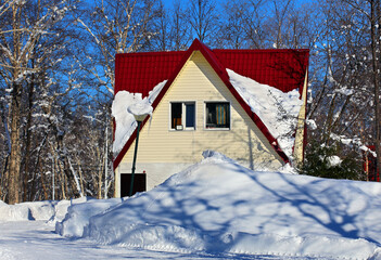 Cottage among the snowdrifts