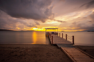 Fototapeta na wymiar sunset at the pier, long exposure