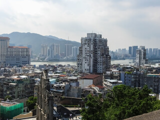 Macau, Island of Macau, China - September 15 2019: view of the  city with Saint Paul's ruins, other old buildings and the sea