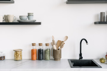 Obraz na płótnie Canvas Nordic style modern kitchen interior design with sink and decor