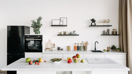 White tones kitchen interior design with food and decor