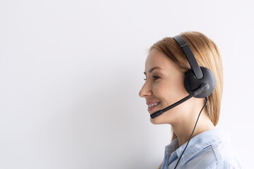 Smiling girl with headset on white background