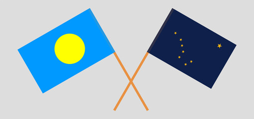 Crossed flags of Palau and the State of Alaska. Official colors. Correct proportion