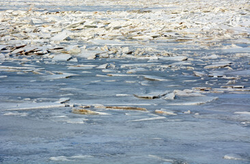 The frozen coast of the Gulf of Finland with a bizarre form of ice. Zelenogorsk, Russia, spring season, ice breaking period