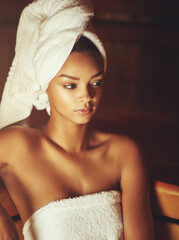 Surrendering to serenity. Cropped shot of a young woman relaxing in the sauna at a spa.
