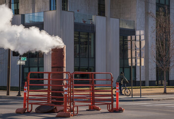 Steam venting from under the street at an intersection