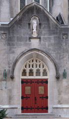 Red door and stone facade of historic church