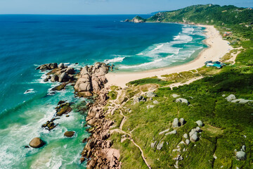 Coastline on Mole beach, rocks and ocean in Brazil. Aerial view of Praia Mole