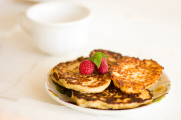 Closeup pancakes with raspberry dessert food sweet berry breakfast eat delicious pastry tasty yummy table cup mug meal white kitchen nobody