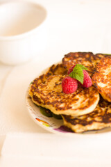 Isolated pancakes with raspberries food dessert sweet berries bakery morning breakfast pastry tasty meal baked white table cup
