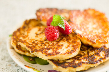 Closeup pancakes with raspberries food dessert sweet breakfast baked eat nobody table
