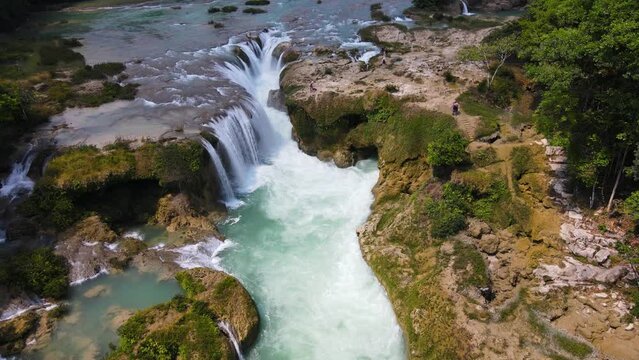Aerial: beautiful tropical waterfall in Mexico rainforest, travel destination