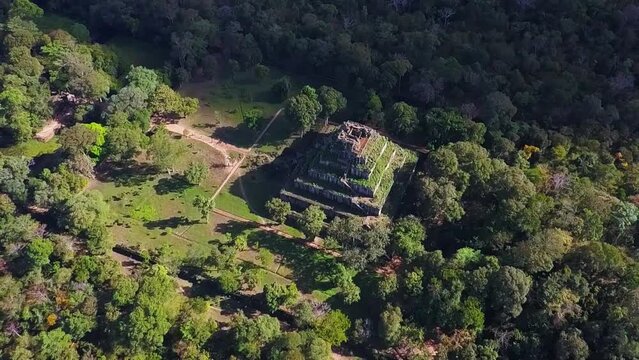 Ancient 10th century temple complex of Koh Ker in the remote jungle of northern Cambodia. Aerial pull away