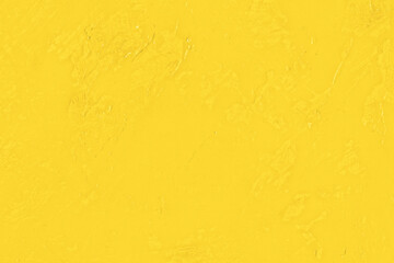 黄色の絵具を塗った無地テクスチャ背景