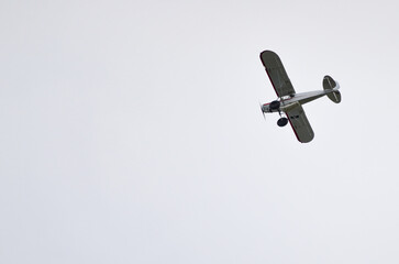 Spectacular airplane flying on white sky background, copy space, Alaska, USA, United States of America