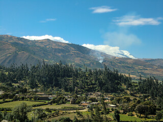 Landscape with rustic houses in Huaraz - Peru, with a snowy peak.