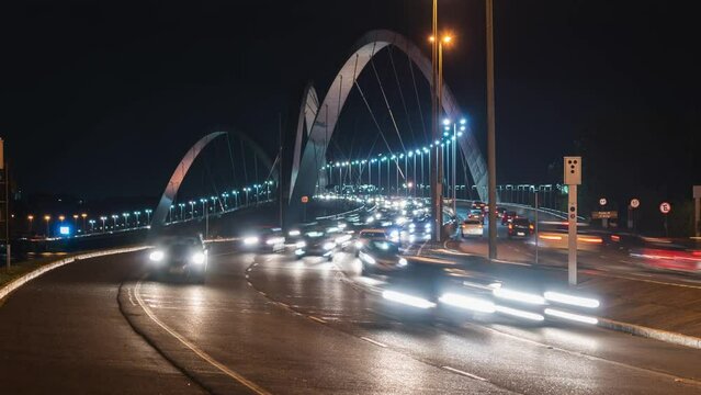 Zoom out time lapse view of rush hour traffic on JK bridge in Brasilia, capital of Brazil.	
