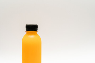 bottle of orange juice surrounded by oranges. juice bottle isolated on white background. fruit and vegetable juice bottle (healthy drink)