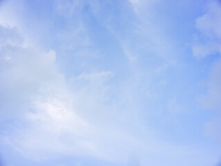 Naklejka na ściany i meble Natural sky background of blue cloudy sky