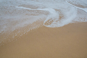Water washing over sand on Australian South Coast beach.