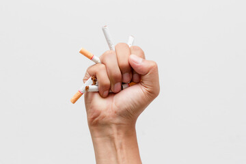  Male hand crushing cigarette, Concept Quitting smoking,World No Tobacco Day