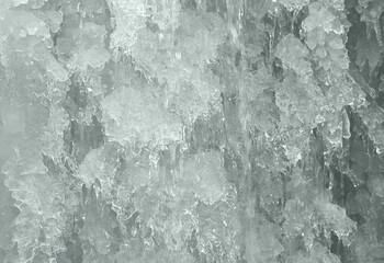 Frozen water in fountain. ice waterfall. Winter background.
