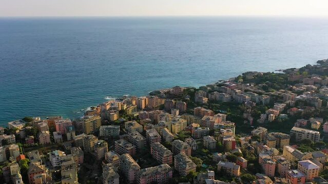 Aerial drone view overlooking the shore of Quarto dei Mille, sunny day in Genova, Italy