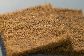Coconut coir. Close-up Coconut fiber. Mattress filler. The concept of filling a mattress. Technology Concept. Furniture manufacture. Industrial and business concept. The concept of filling a mattress.