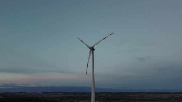Modern wind turbine with rotor located in rural environment by the Alps in the district Ebersberg in Bavaria. The 10h rule prevents the construction of renewable and sustainable energy. Aerial drone