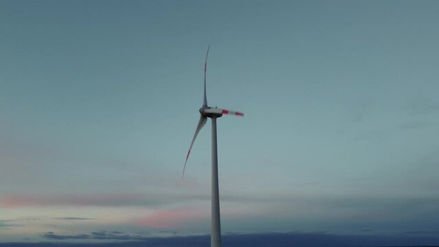 Wind turbine with rotor located in rural environment by the Alps in the district Ebersberg in Bavaria. The 10h rule prevents the construction of modern renewable and sustainable energy. Aerial drone
