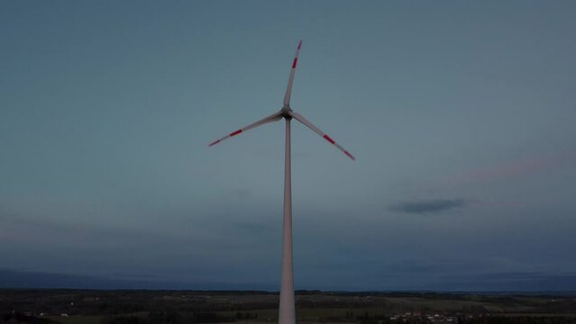 Modern wind turbine with rotor located in rural environment by the Alps in the district Ebersberg in Bavaria. The 10h rule prevents the construction of renewable and sustainable energy. Aerial drone