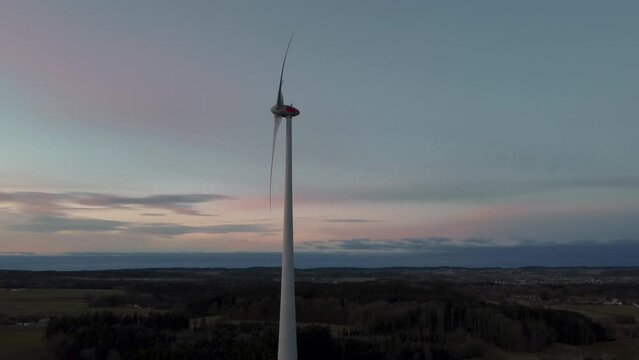 Modern wind turbine with rotor located in rural environment by the Alps in the district Ebersberg in Bavaria. The 10h rule prevents the construction of renewable and sustainable energy. Aerial drone