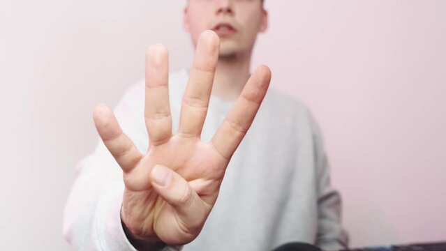 Close-up of the counting with the fingers. Count to five. five fingers in the frame. High quality 4k footage