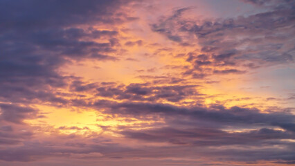 Naklejka na ściany i meble amazing clouds at sunset with orange and blue sky