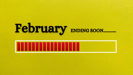 Top view of loading bar showing the end of February month with yellow paper background.