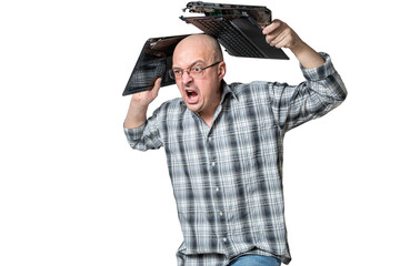 Aggressive man with digital addiction smashes laptop from head