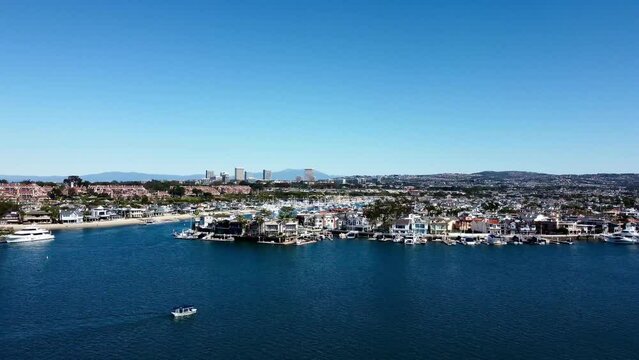 Drone Video at 100ft of Newport Harbor over Lido Island, rotating in a circle