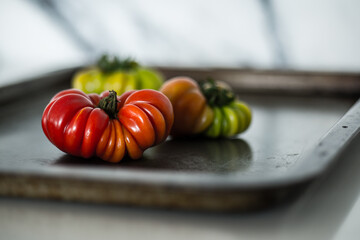 Gourmet tomatoes on baking tray.