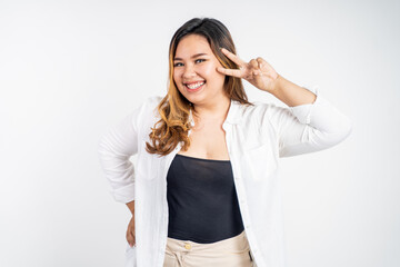 asian woman with cute hand gesture making v shape on finger