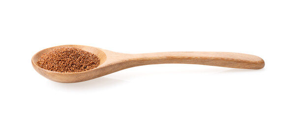 Brown Teff Grain in wood spoon on white