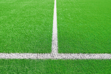 Part of football or soccer field close up, Artifical green grass with white border lines, Astroturf...