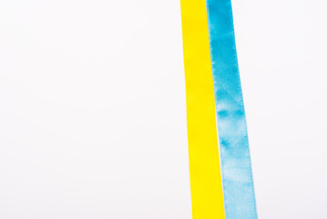 Ribbons colored of flags of Ukraine on a white background. isolated, copy space. war 2022, independence of Ukraine