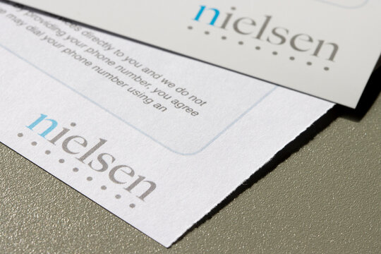Portland, OR, USA - Feb 21, 2022: Closeup of the Nielsen logo seen on the mail from Nielsen Survey. Nielsen Holdings Inc. is an American information, data and market measurement firm.