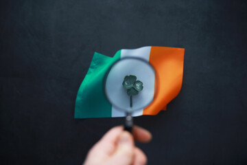 Saint patrick's day background with ireland flag. Religious Christian holiday. Four-leaf clover...