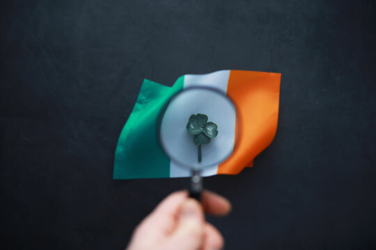 Saint patrick's day background with ireland flag. Religious Christian holiday. Four-leaf clover symbol of good luck.