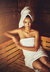 Serene time in the sauna. Cropped portrait of a young woman relaxing in the sauna at a spa.
