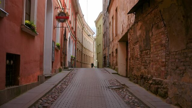 Narrow Cobbled Street Of Vilnius Old Town In Lithuania During Daytime. Aerial Drone