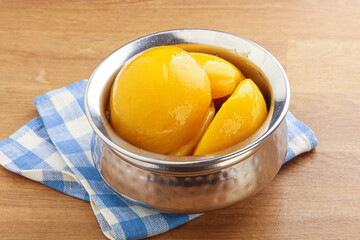 Sweet canned peaches with syrope