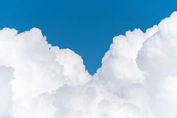 Obraz na płótnie Canvas blue sky background with tiny clouds. Cloudscape - Blue sky and white clouds, wide panorama