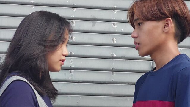 A Teen Boy And Girl Arguing